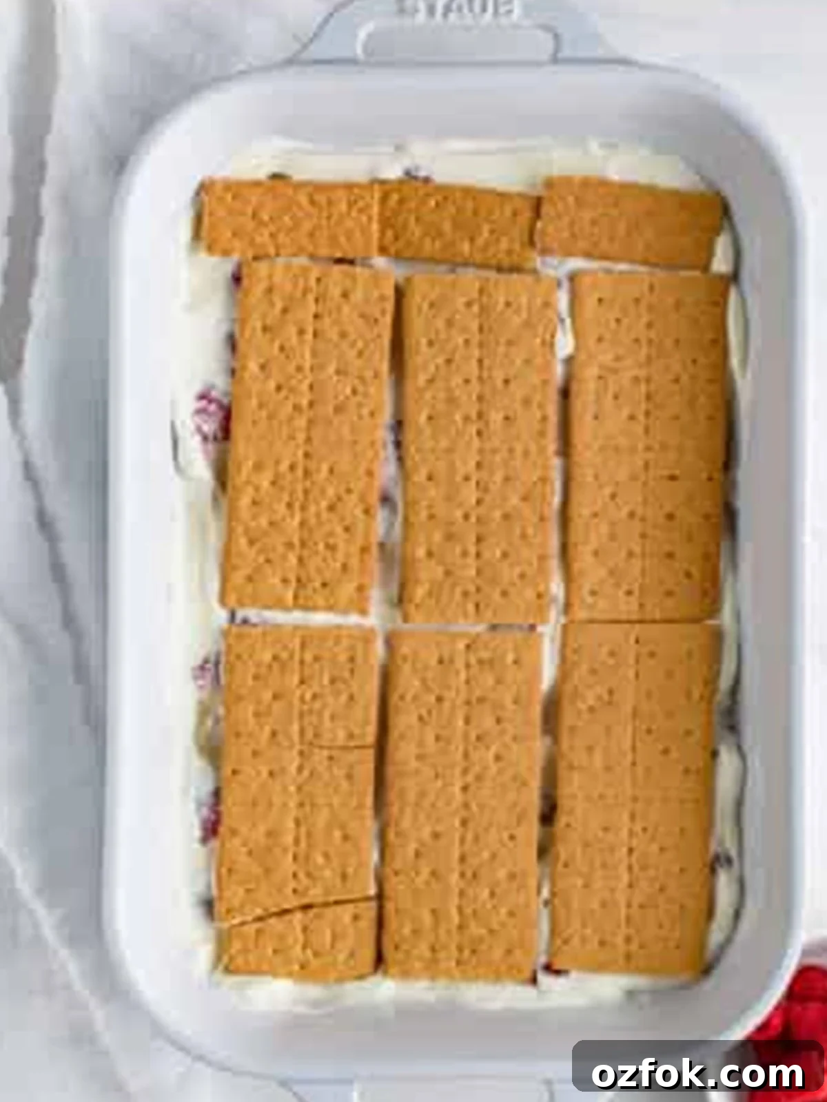 No-Bake Raspberry Icebox Cake Recipe for Summer Parties 10 Second layer of graham crackers added to the Raspberry Icebox Cake.
