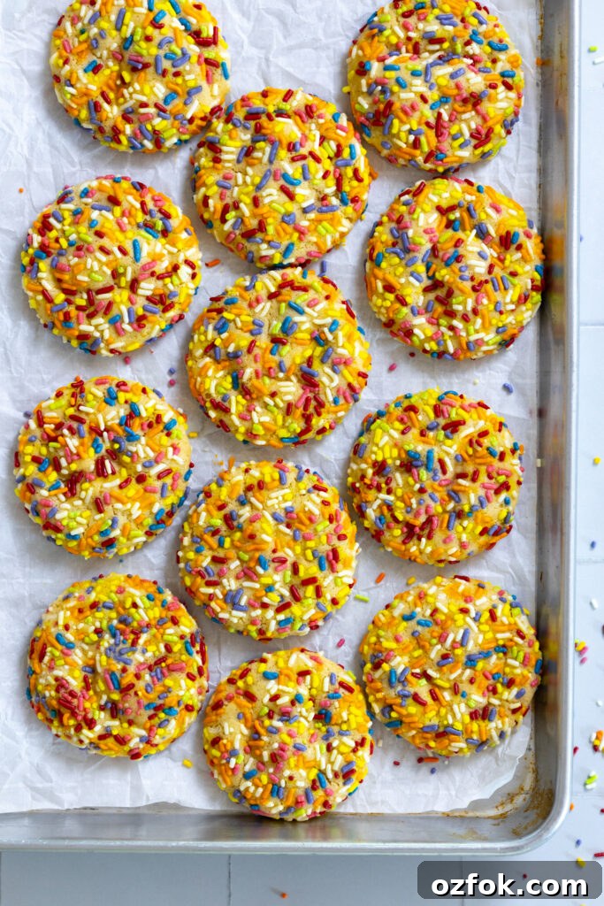 Lemon Rainbow Sprinkle Cookies Recipe — Bright Citrus Sugar Cookies 22 Lemon Rainbow Sprinkle Cookies on baking sheet