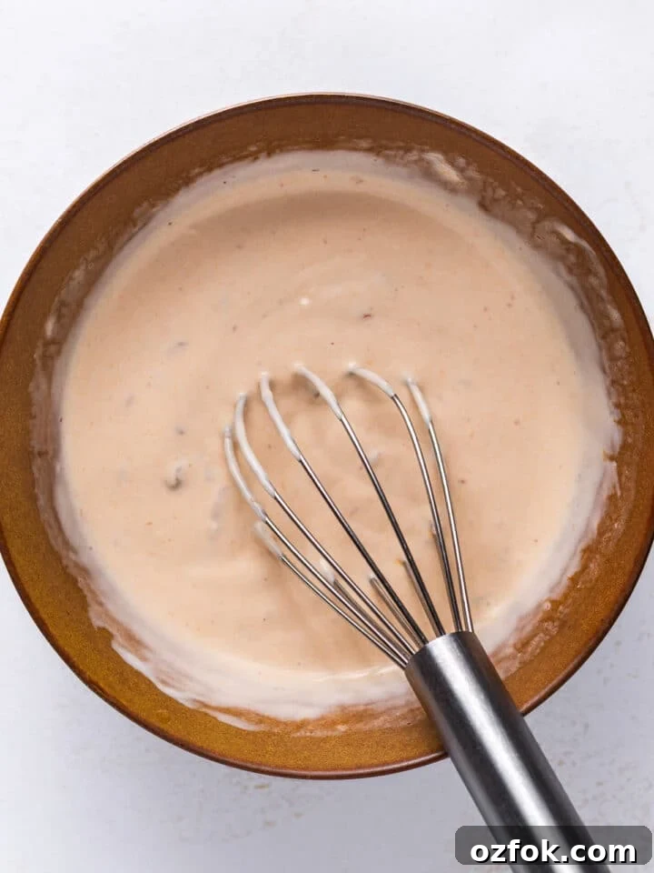 Chipotle Lime Sauce Recipe for Grilled Meats and Tacos 5 chipotle lime sauce whisked together in a brown bowl