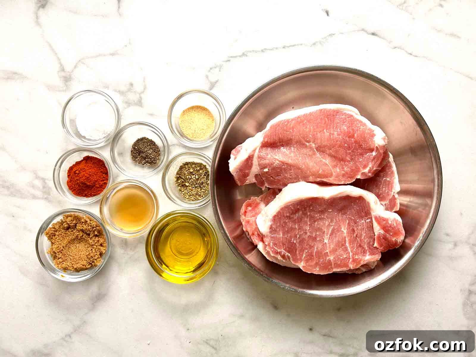 Juicy Oven-Baked Pork Chops with Garlic and Herbs 4 ingredients prepped in bowls.