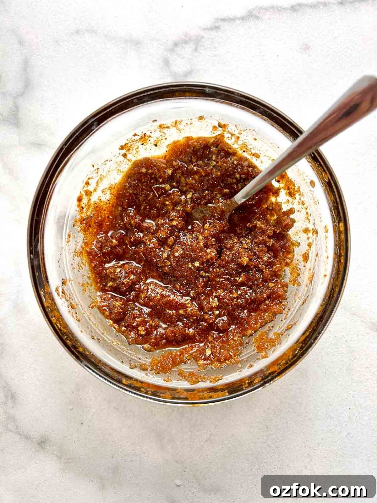 Juicy Oven-Baked Pork Chops with Garlic and Herbs 5 spice mixture in bowl.