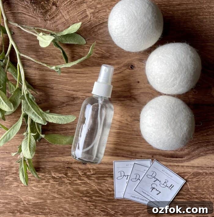 DIY Dryer Ball Spray with Essential Oils for Fresh Laundry 6 3 wool dryer balls, glass spray bottle, and free printable labels for homemade dryer ball spray