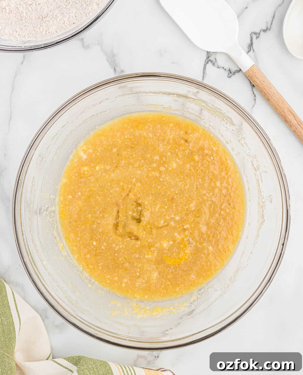 Moist Applesauce Muffins with Warm Cinnamon Sugar Topping 6 wet ingredients in a mixing bowl