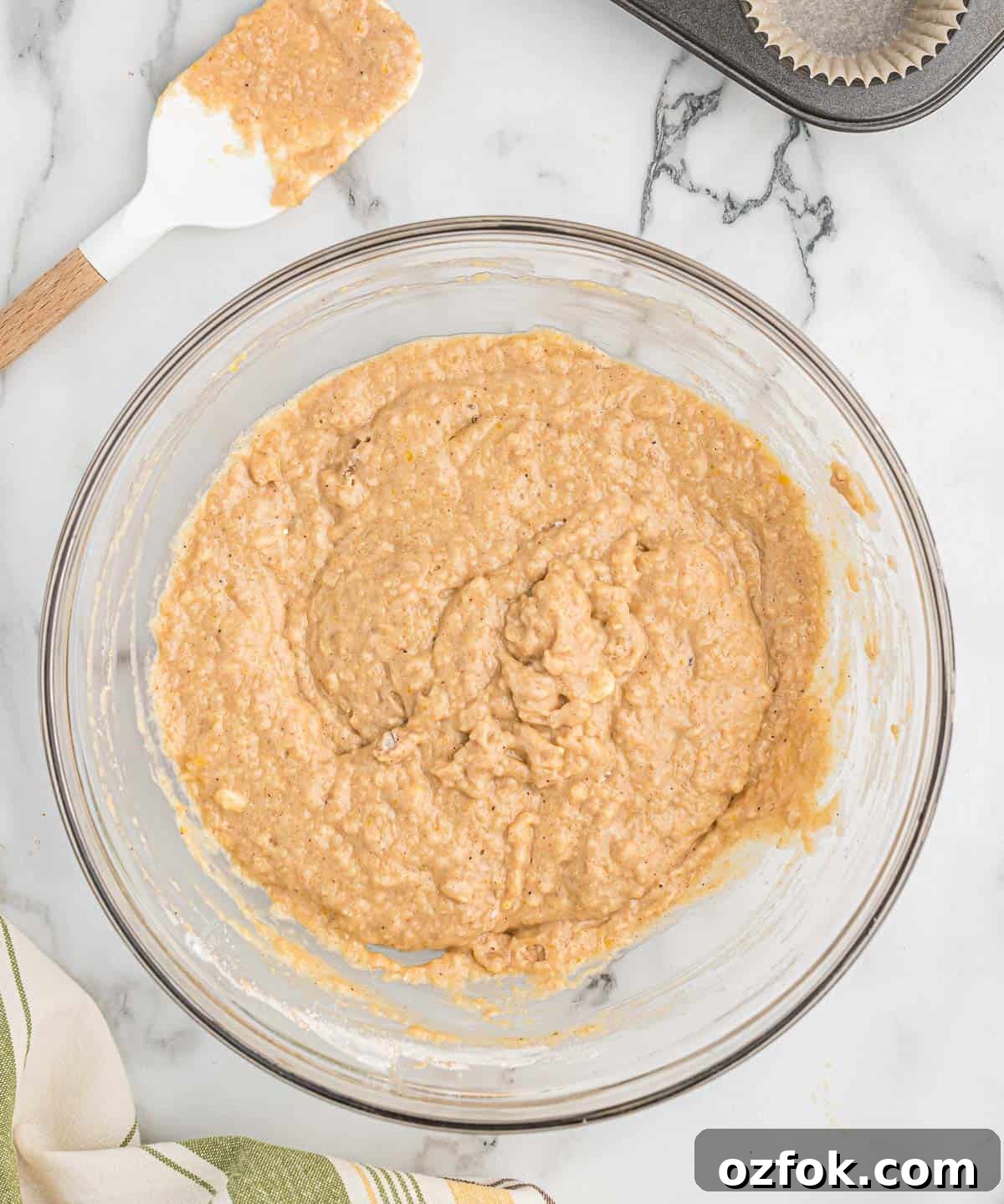 Moist Applesauce Muffins with Warm Cinnamon Sugar Topping 8 applesauce muffin batter mixed together