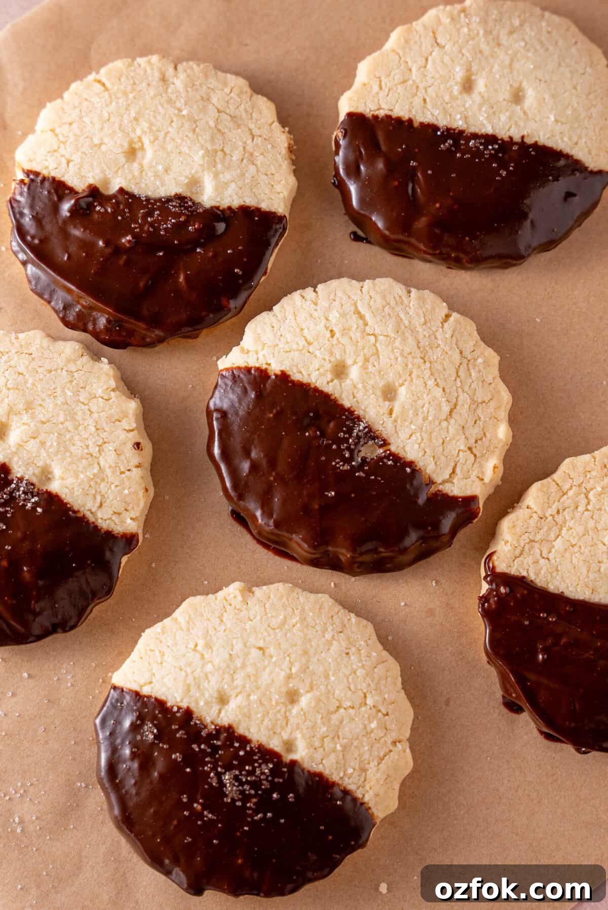 Buttery Gluten-Free Shortbread Cookies Recipe 3 Gluten free shortbread biscuits half-dipped in chocolate.