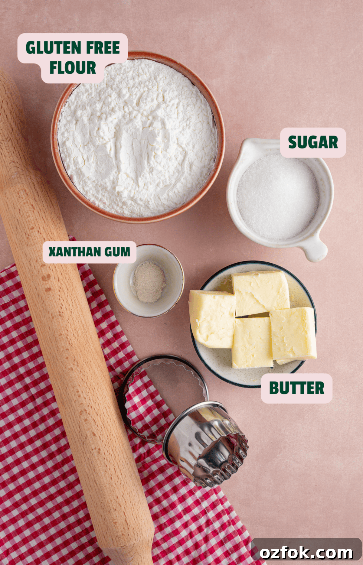 Buttery Gluten-Free Shortbread Cookies Recipe 4 Ingredients for gluten free shortbread with text labels, alongside a rolling pin and biscuit cutters.