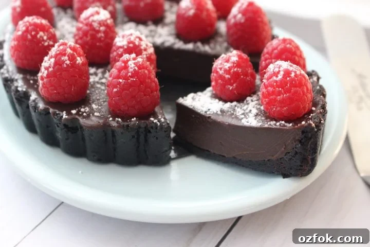 Raspberry Bailey's Chocolate Tart Recipe for Decadent Dessert 2 A slice of Raspberry chocolate tart