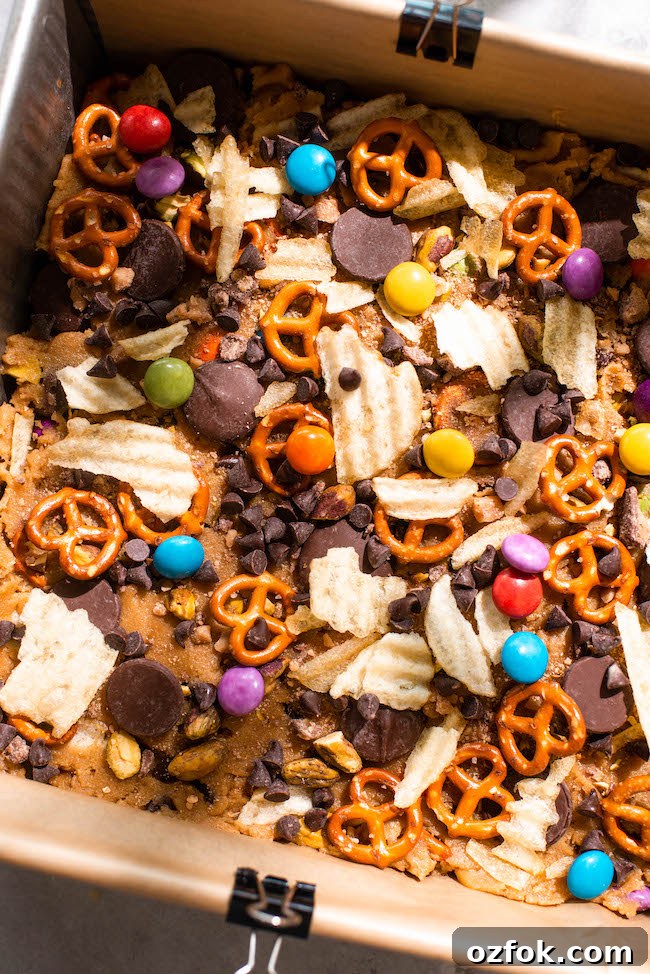 Ultimate Kitchen Sink Cookie Bars Recipe — Loaded with Mix-Ins 9 Bars on plate