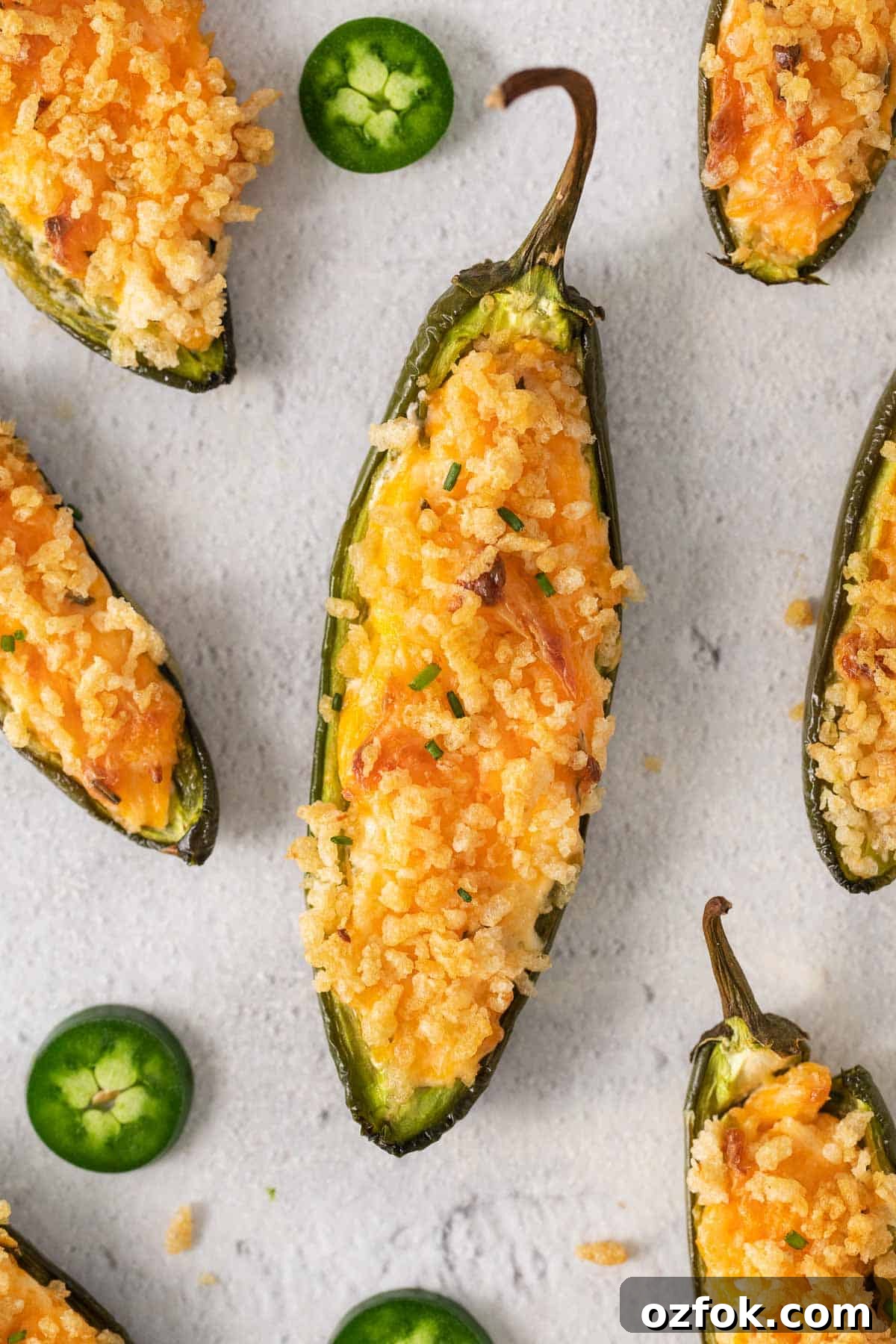 Gluten-Free Jalapeño Poppers Recipe: Crispy Stuffed Peppers 3 A close-up of gluten-free jalapeno poppers on a baking sheet