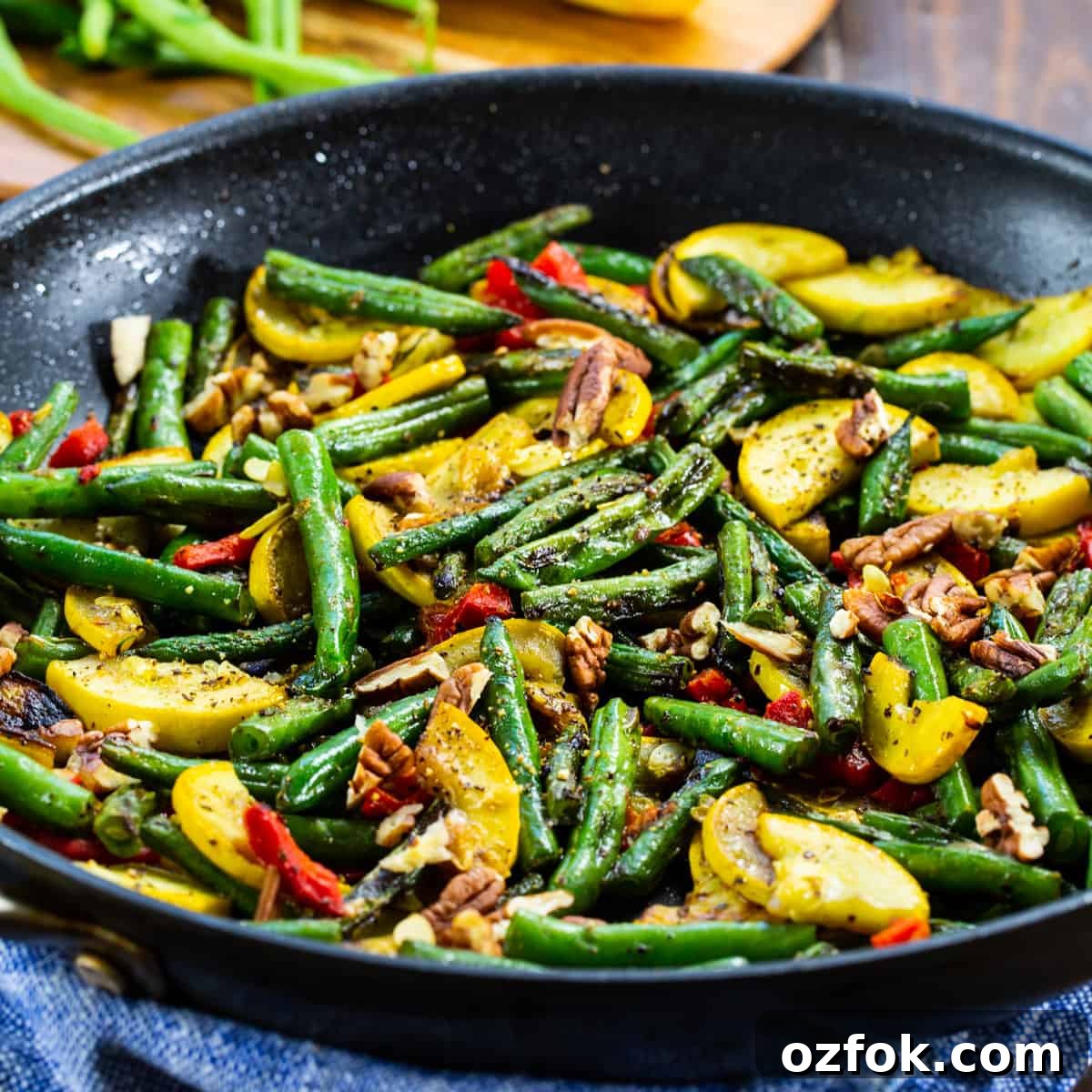 Sautéed Green Beans and Yellow Squash with Garlic and Lemon 2 Green Bean and Yellow Squash Saute in a skillet.
