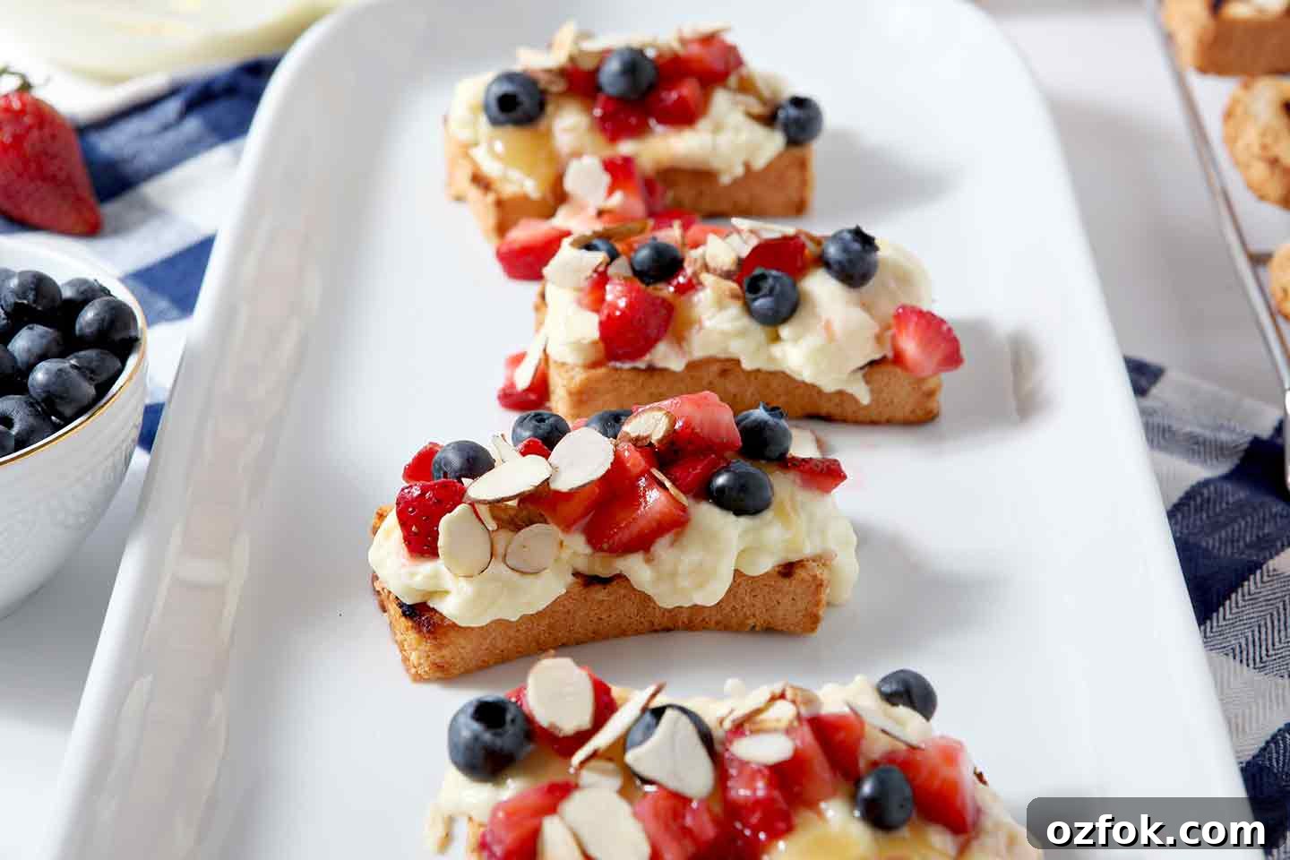 20+ Fourth of July Grilling Recipes for Your Backyard BBQ 17 Slices of Strawberry Bruschetta on a white platter
