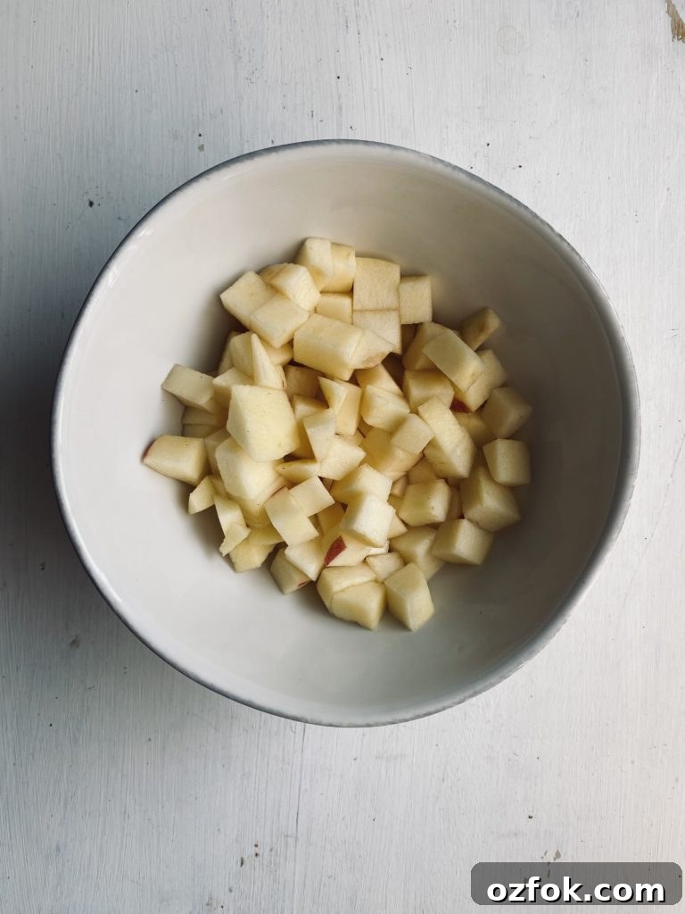 Gluten-Free Cinnamon Apple Crumble Panna Cotta Recipe 3 a bowl with diced apples to make caramel apple topping
