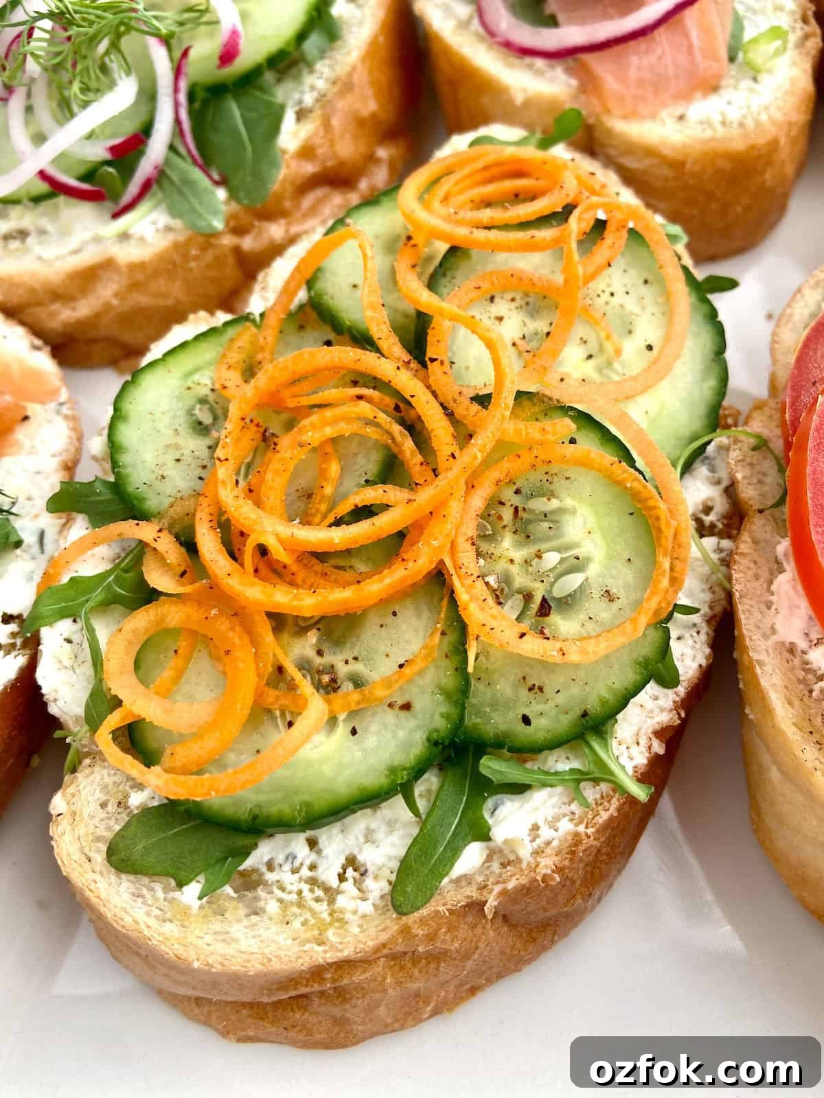 8 Flavorful Vegetarian Bruschetta Toppings for Every Occasion 10 Sliced cucumbers and arugula on bread.