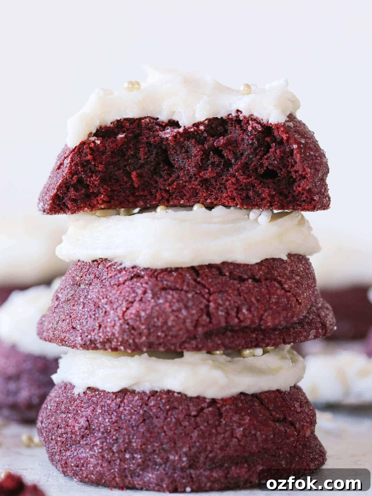 Decadent Red Velvet Cookies Recipe (Soft & Chewy) 2 Stacked red velvet cookies deep red in color.