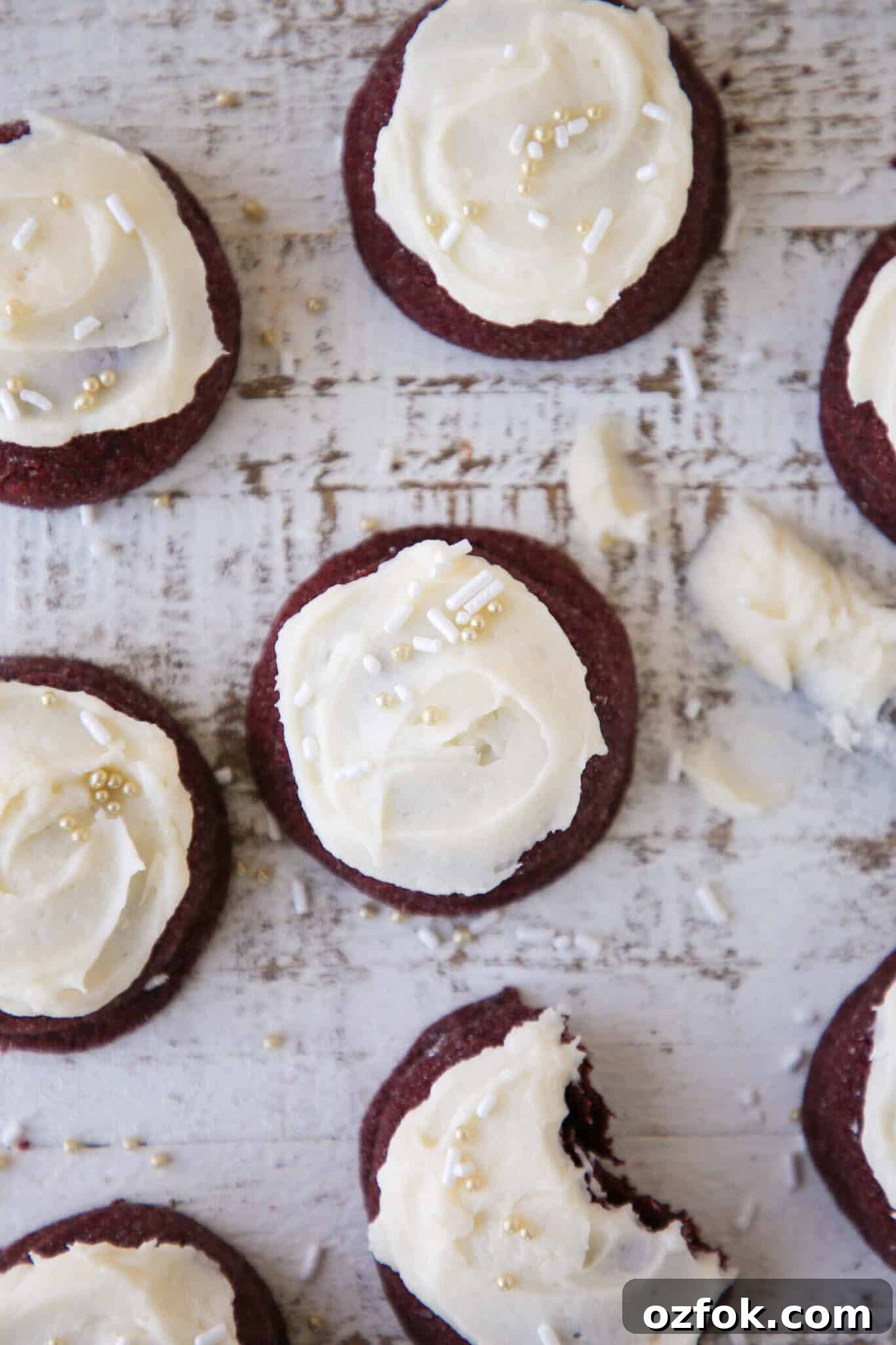 Decadent Red Velvet Cookies Recipe (Soft & Chewy) 4 Red velvet cookies grouped on a beige backdrop.