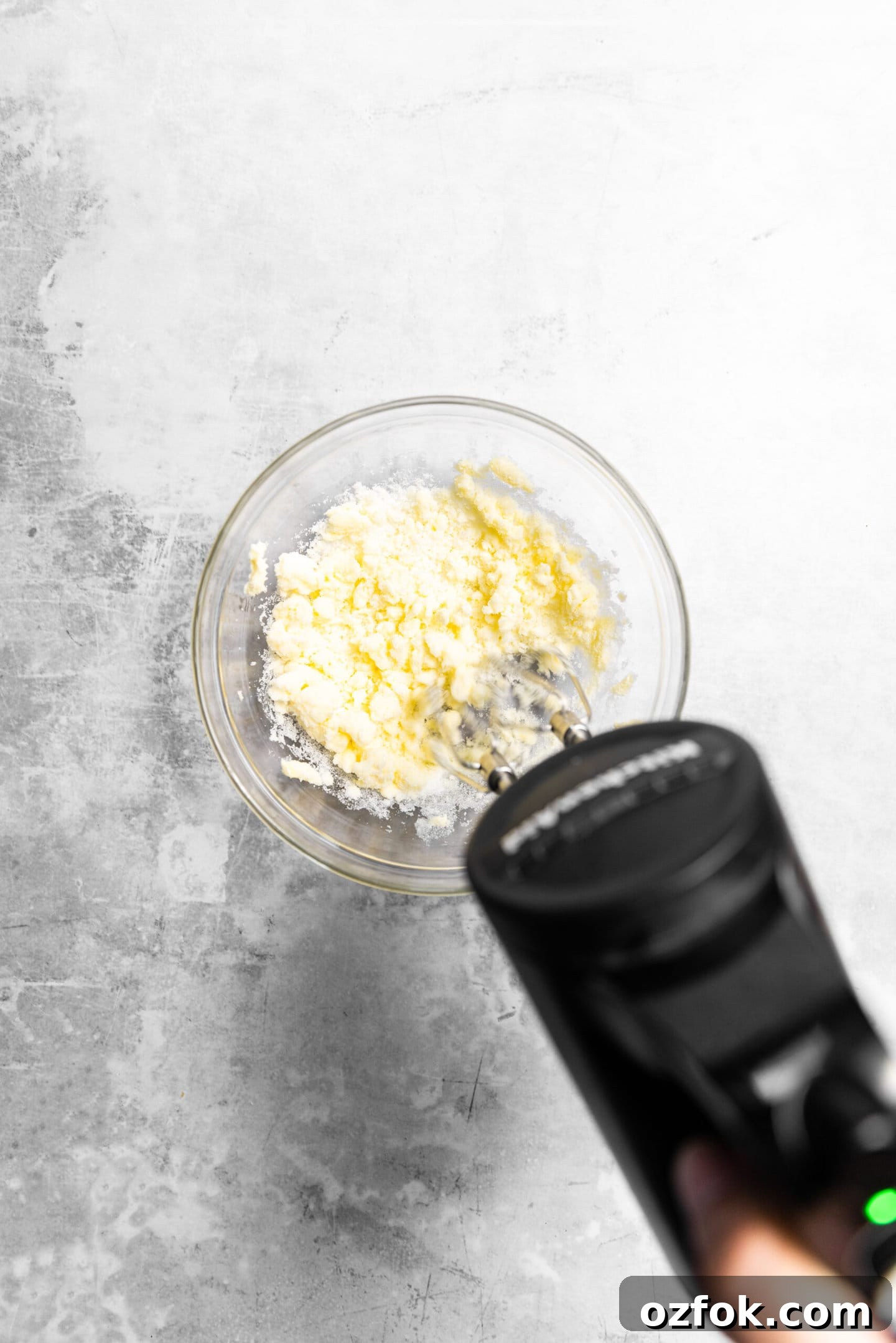 Butter and sugar being creamed together.