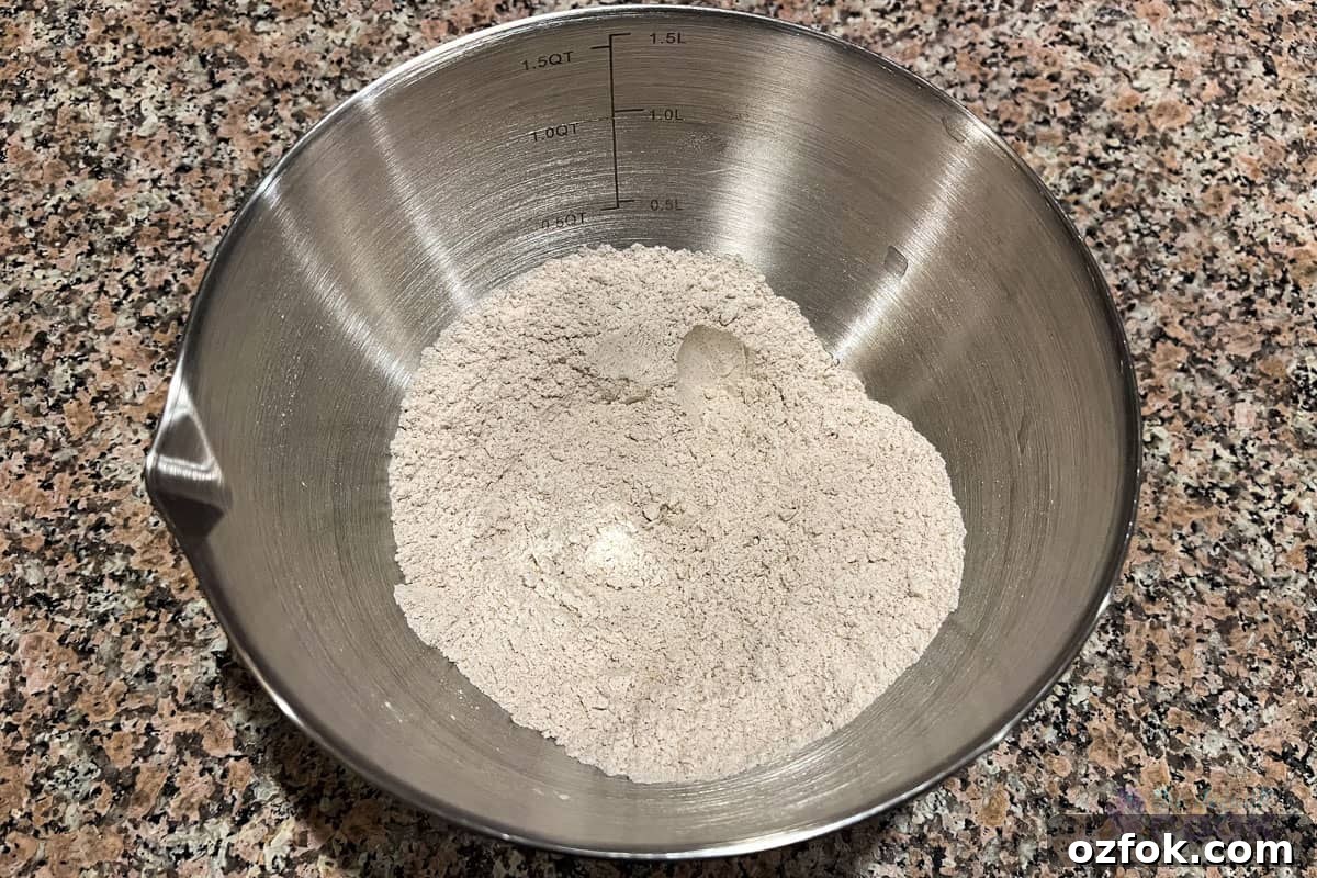 Mixed dry ingredients in a small metal bowl on a counter.