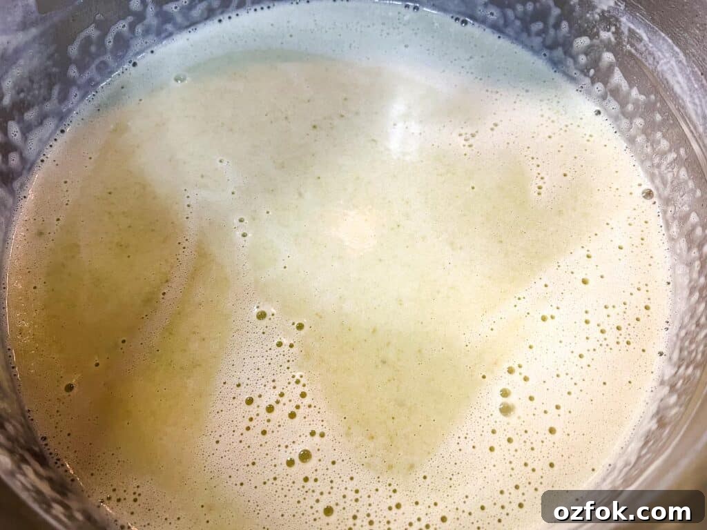 Creamy Jalapeño Soup Recipe: Smooth, Spicy, and Cozy 8 Simmering the soup with the added cream.