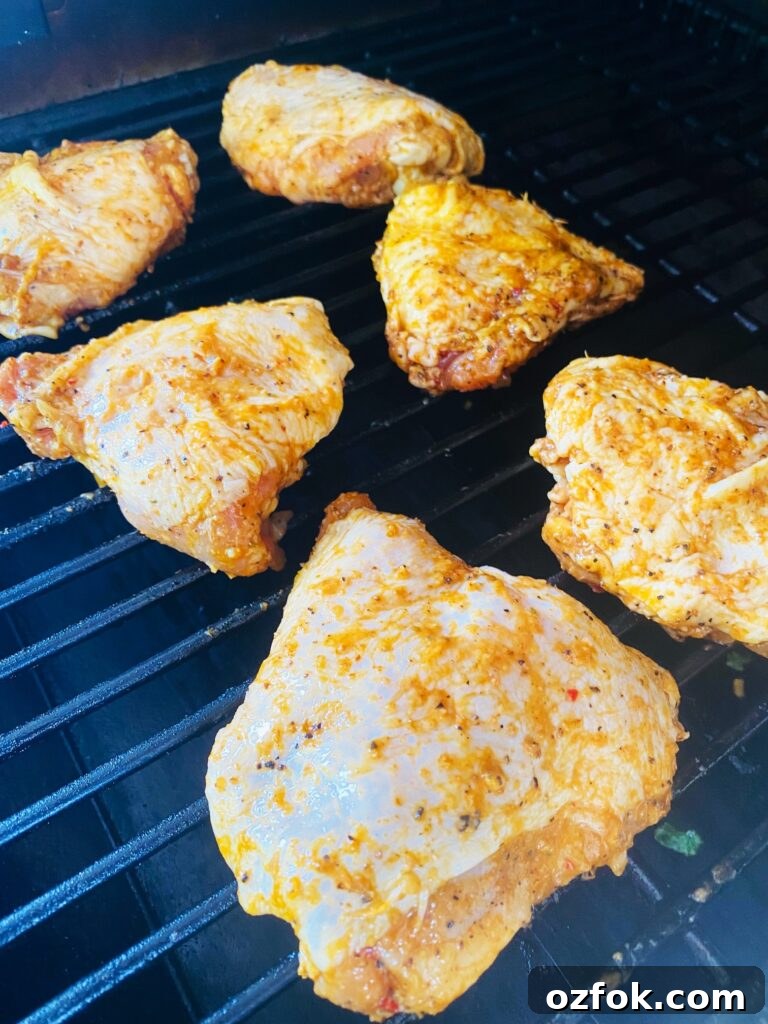 Smoked Cajun Chicken Thighs Recipe: Juicy, Spiced & Smoky 3 thighs on the smoker before cooking