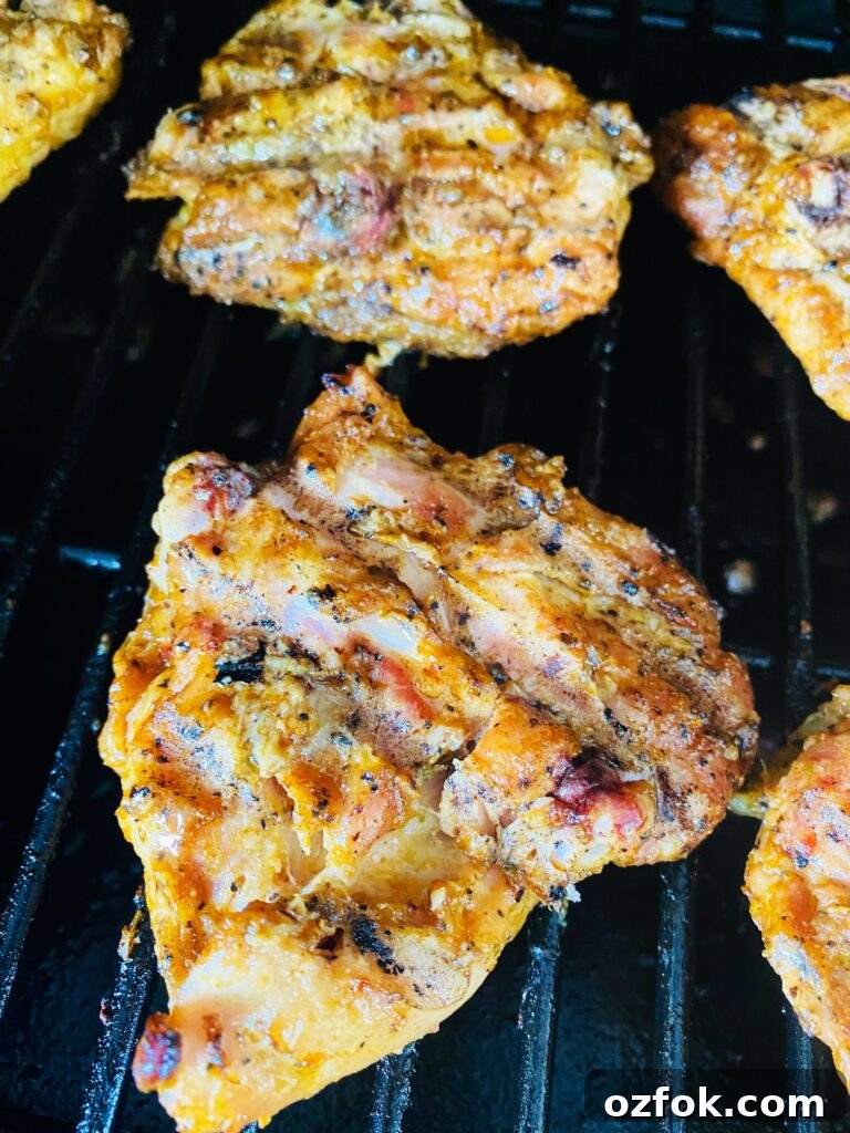 Smoked Cajun Chicken Thighs Recipe: Juicy, Spiced & Smoky 5 chicken on the smoker after flipping