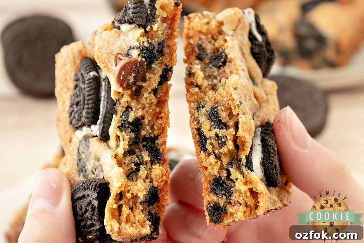 Decadent Oreo Cookie Bar Recipe: Chewy, No-Bake Dessert 14 Cookie bar broken in half.