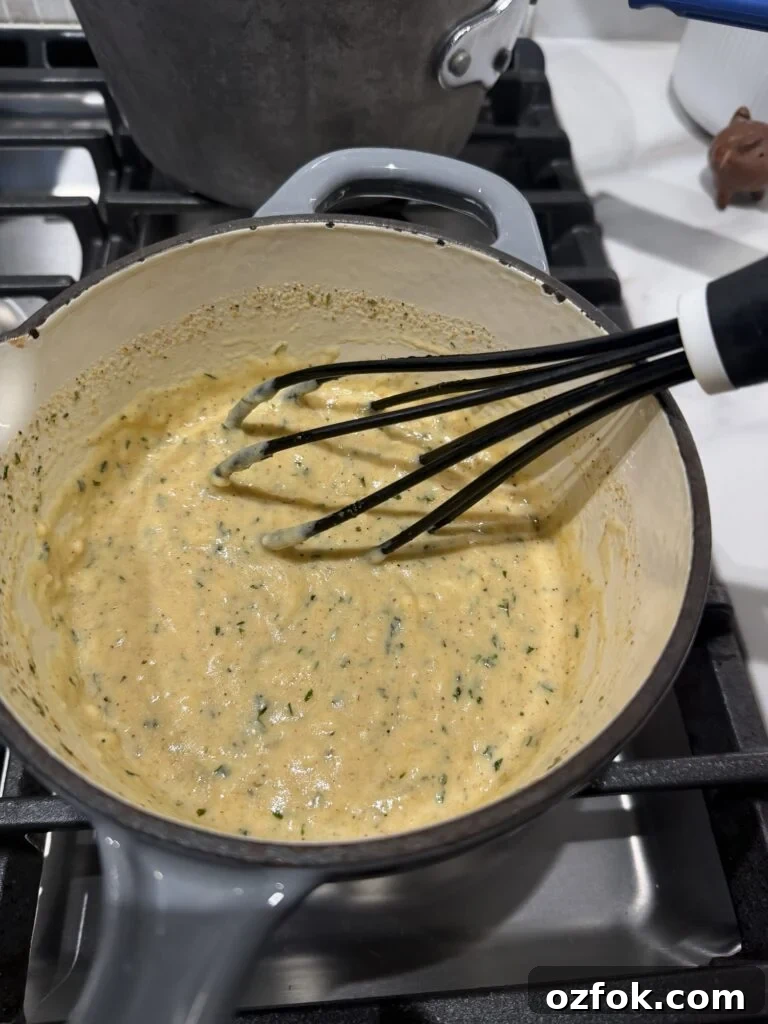 Creamy Chicken Kiev Casserole Bake 5 The sauce in a pot