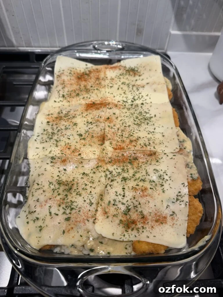 Creamy Chicken Kiev Casserole Bake 10 Cheese on top of the casserole base