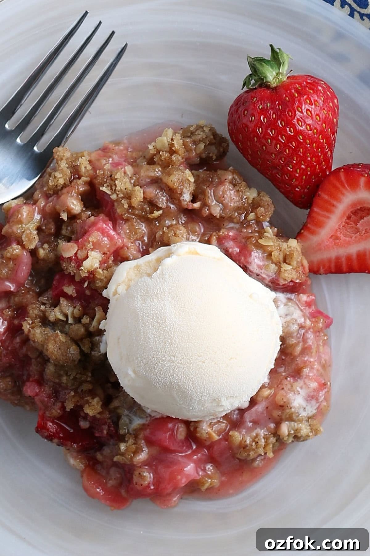 Strawberry Rhubarb Crisp top view top view of Strawberry Rhubarb Crips in on a plate