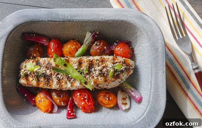 Spread Za'atar over freshly cut Halibut - grill with colorful Cherry Tomatoes and Onions