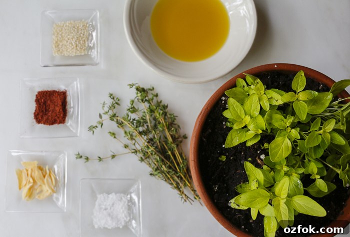 Ingredients for my Za'atar mix - Sesame Seeds, Sumac, Garlic, Flaked Salt, Fresh Oregano & Thyme and Extra Virgin Olive Oil