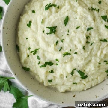 overhead shot of garlic mashed cauliflower in bowl