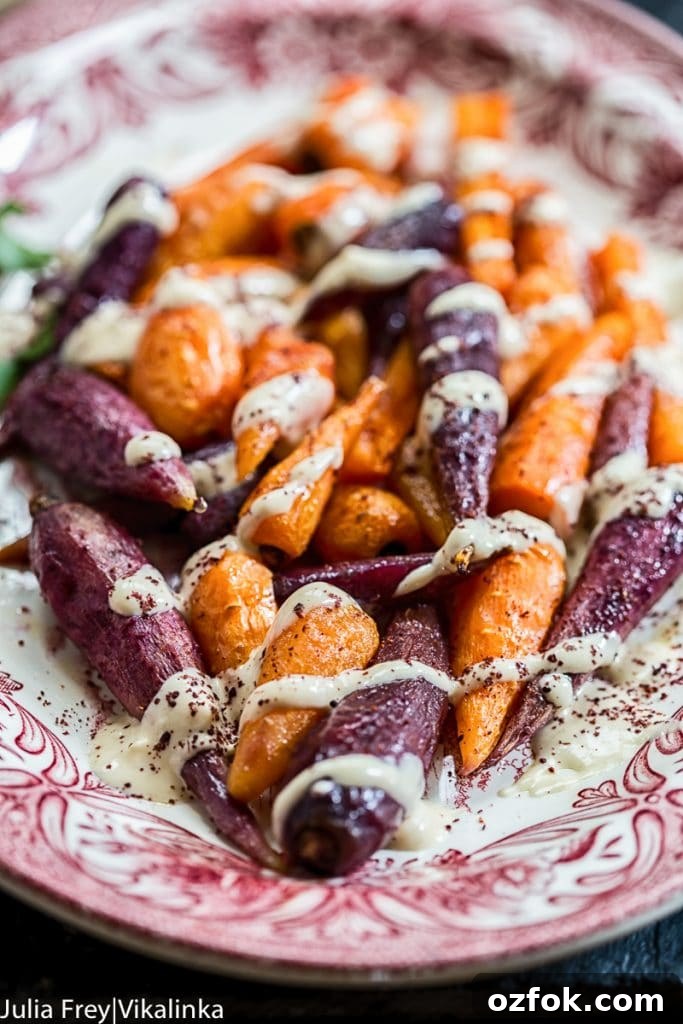 Roasted Carrots with Lemon Tahini and Garlic Sauce 2 plate of roasted carrots with drizzled tahini sauce