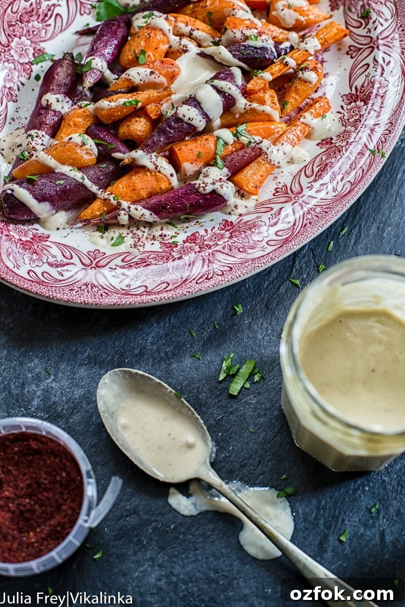 Roasted Carrots with Lemon Tahini and Garlic Sauce 5 platter of roasted carrots with jam jar of garlicky tahini sauce