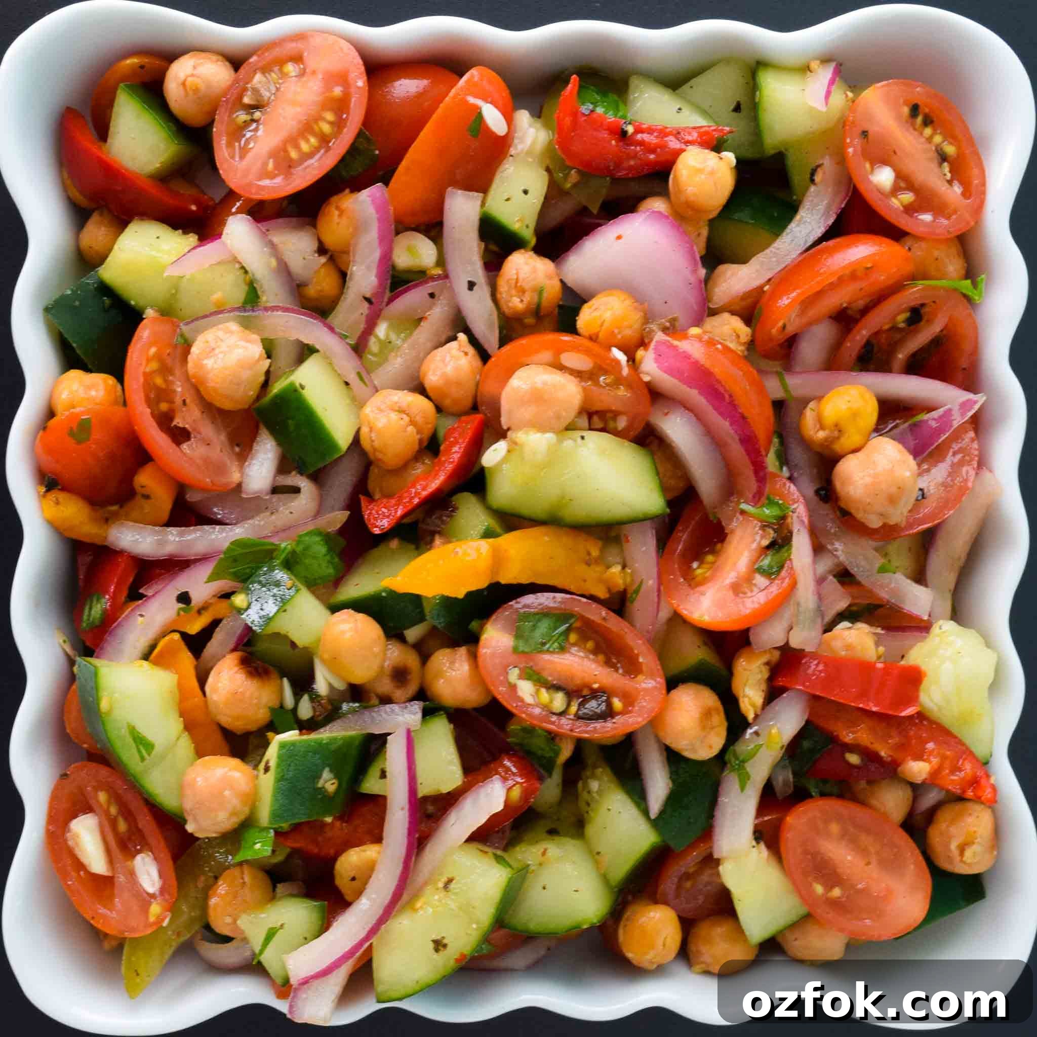 Roasted Chickpea Panzanella Salad in white tray ready to be served overhead shot
