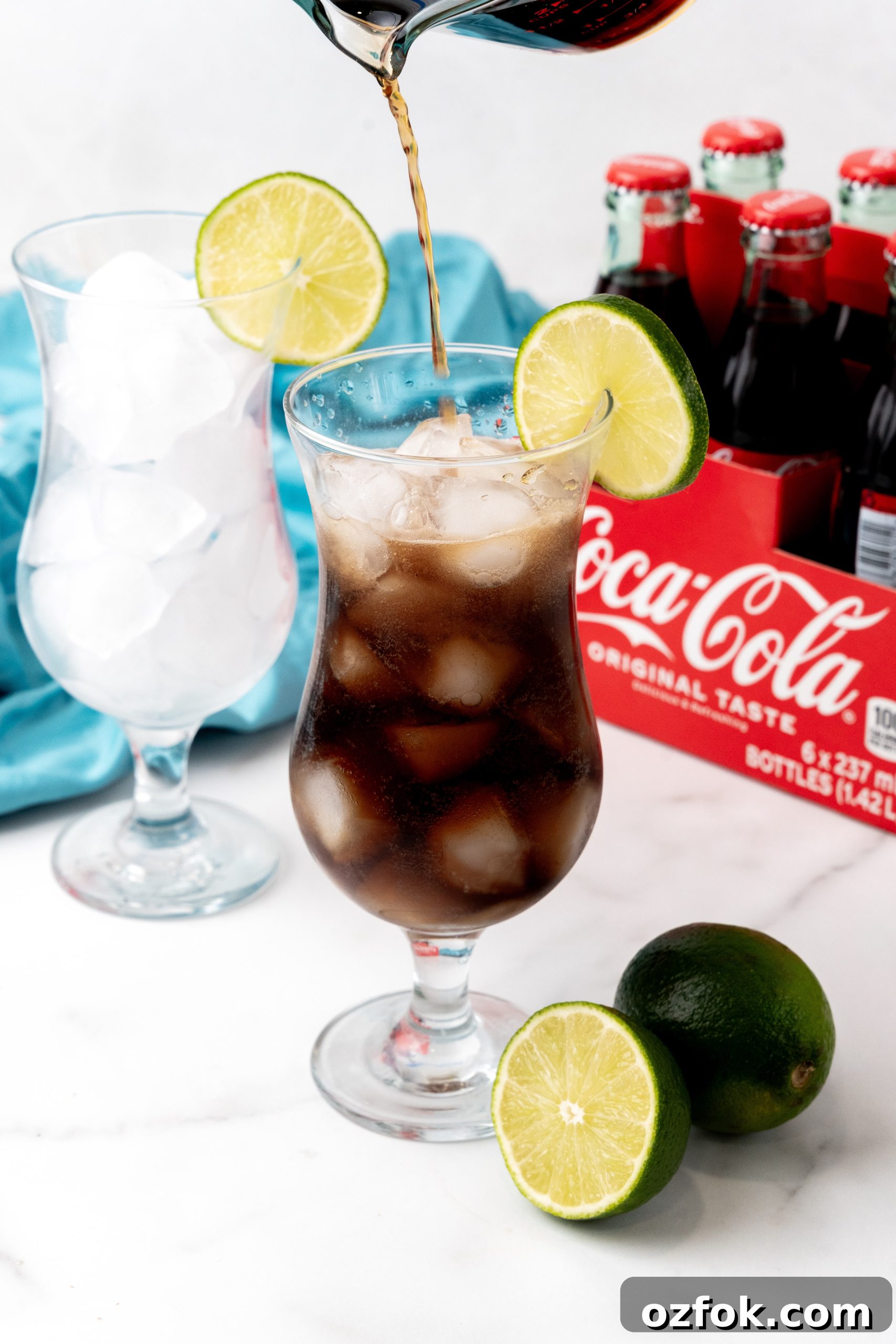 How to Make Viral Dirty Soda at Home: TikTok Recipe Guide 5 cocoa cola soda being poured over ice in to a drinking glass