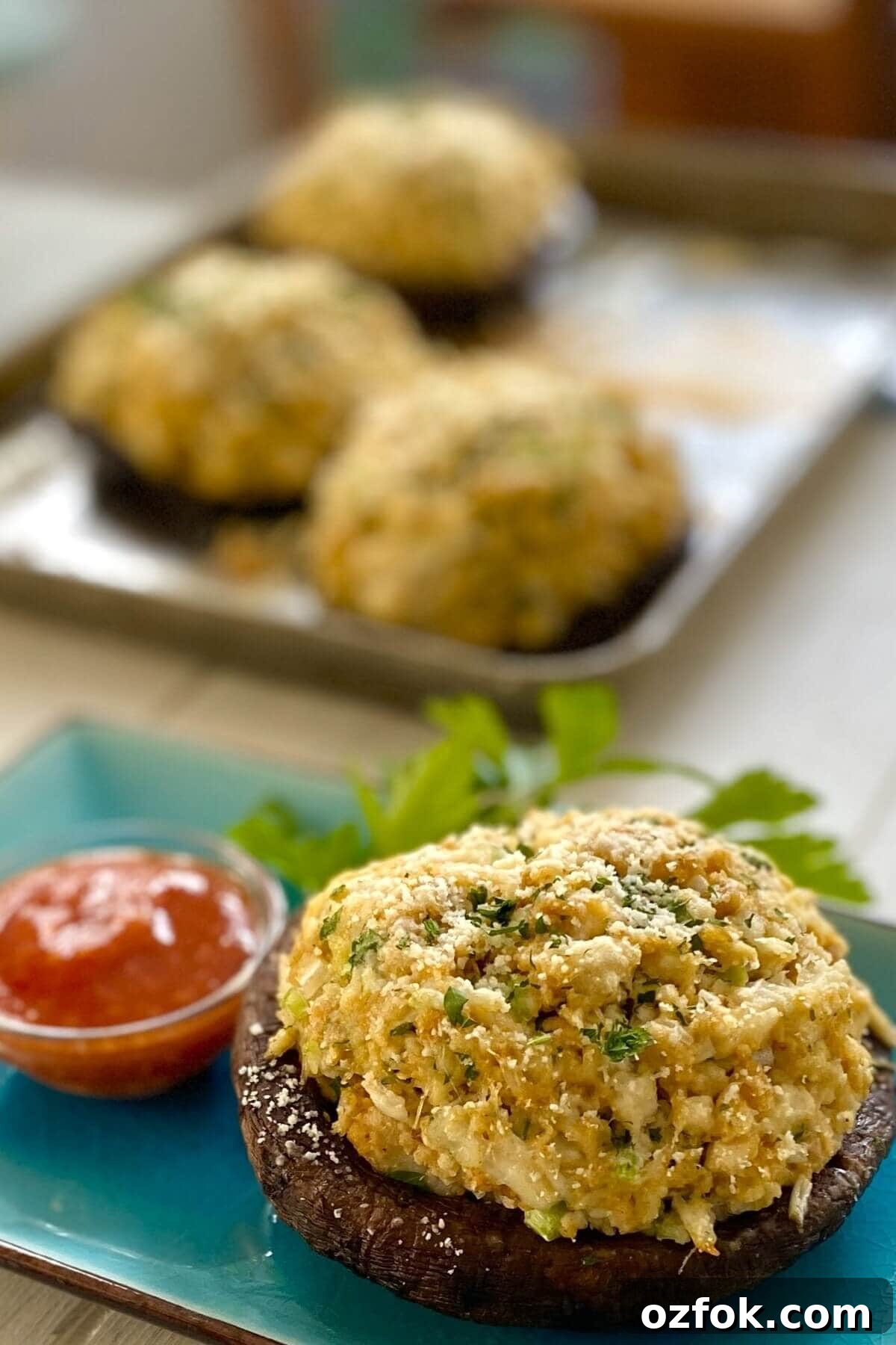 crab stuffed portobello with sauce.