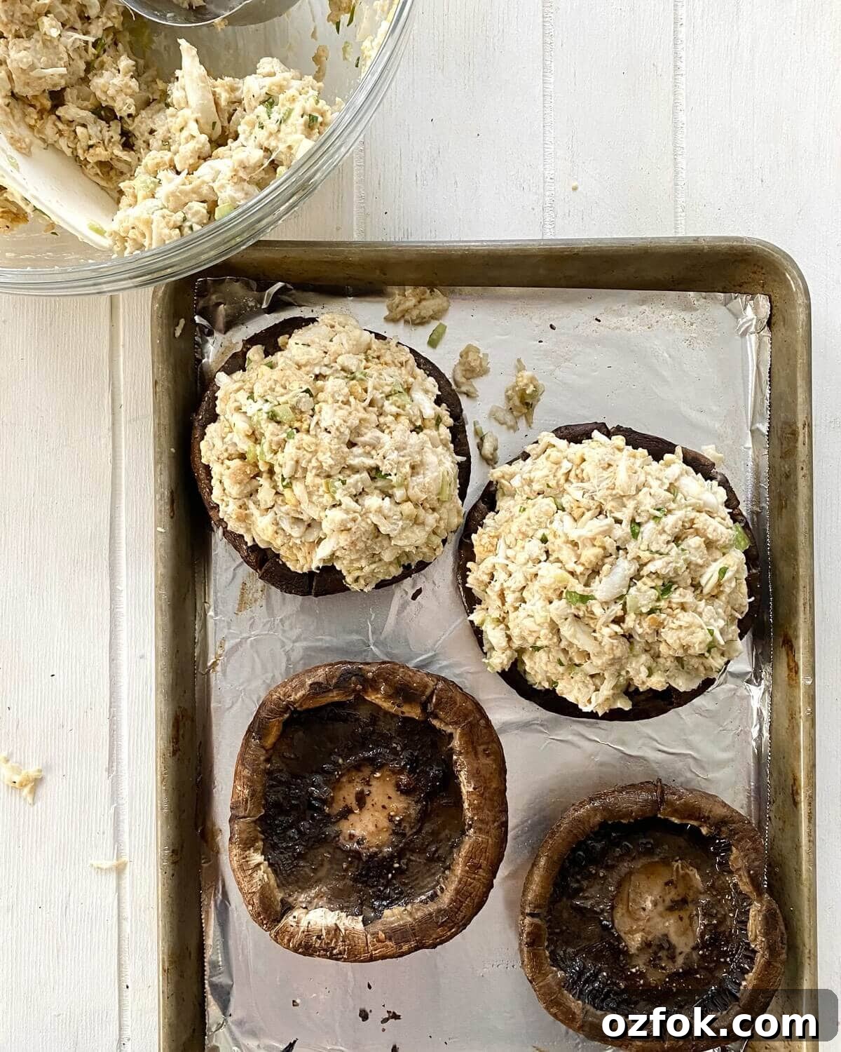 2 crab stuffed portobello mushrooms. and 2 empty mushrooms.