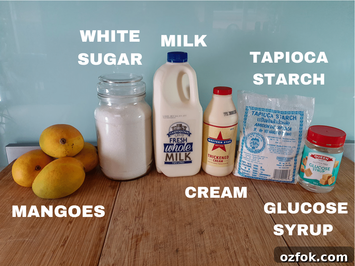 Creamy Mango Ice Cream Recipe: Fresh Mango Frozen Dessert 3 Mango ice cream ingredients laid out.