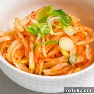 Spicy Korean Radish Salad (Musaengchae) — Authentic Recipe 15 spicy Korean radish salad in a white bowl