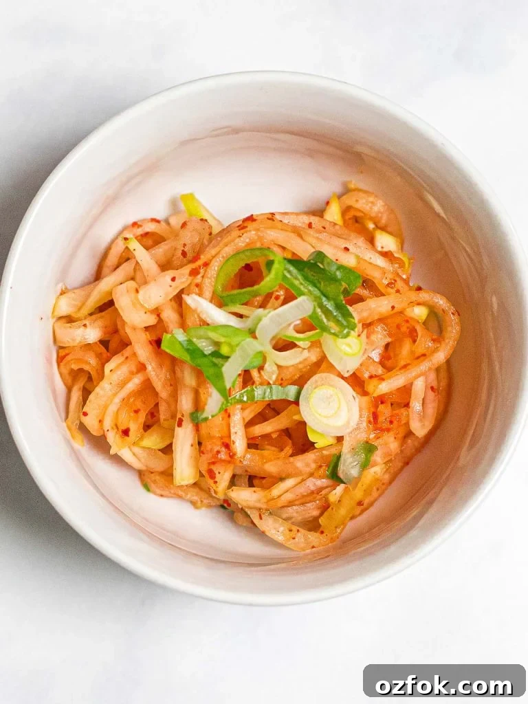 Spicy Korean Radish Salad (Musaengchae) — Authentic Recipe 3 spicy Korean radish salad in a small white bowl