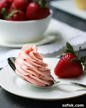 Chocolate Whipped Cream Frosting with Cream Cheese 8 Strawberry Whipped Cream Cream Cheese Frosting on a spoon.