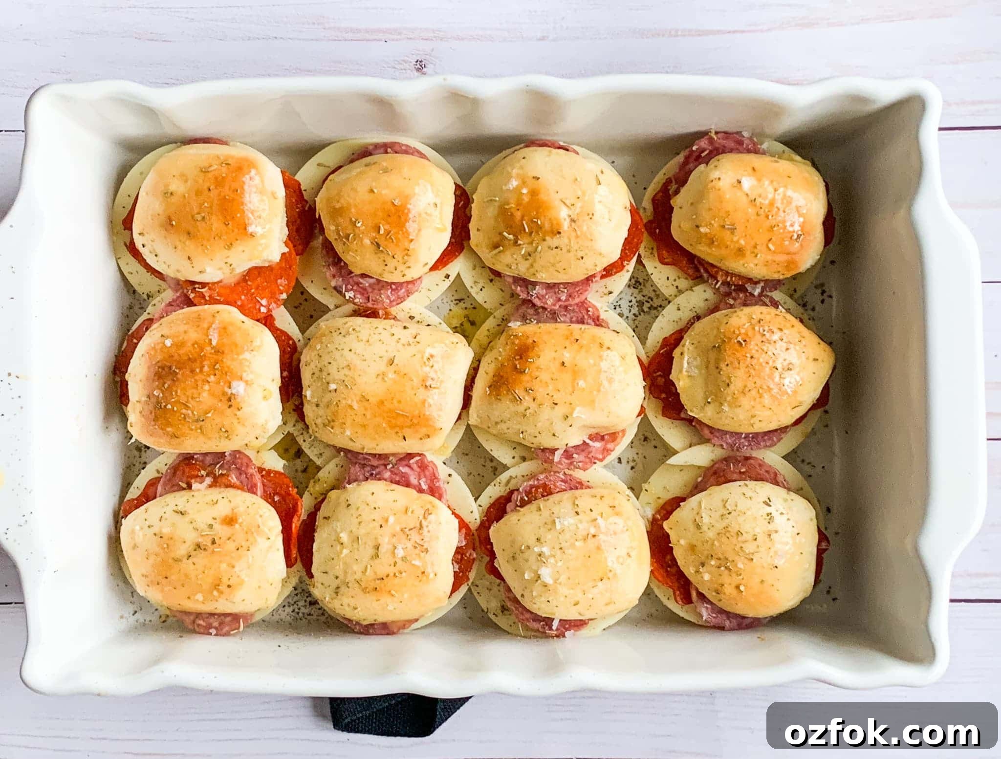Italian Slider Recipes: Flavorful Mini Sandwiches for Entertaining 6 baked Super Bowl sliders filled with deli meats and cheese