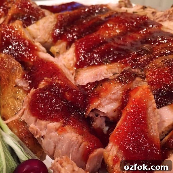 Cranberry-Apricot Glazed Pork Roast: Juicy Holiday Centerpiece 7 Sliced Pork Roast drizzled with Cranberry Apricot Glaze