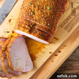 Sliced pork loin on cutting board.