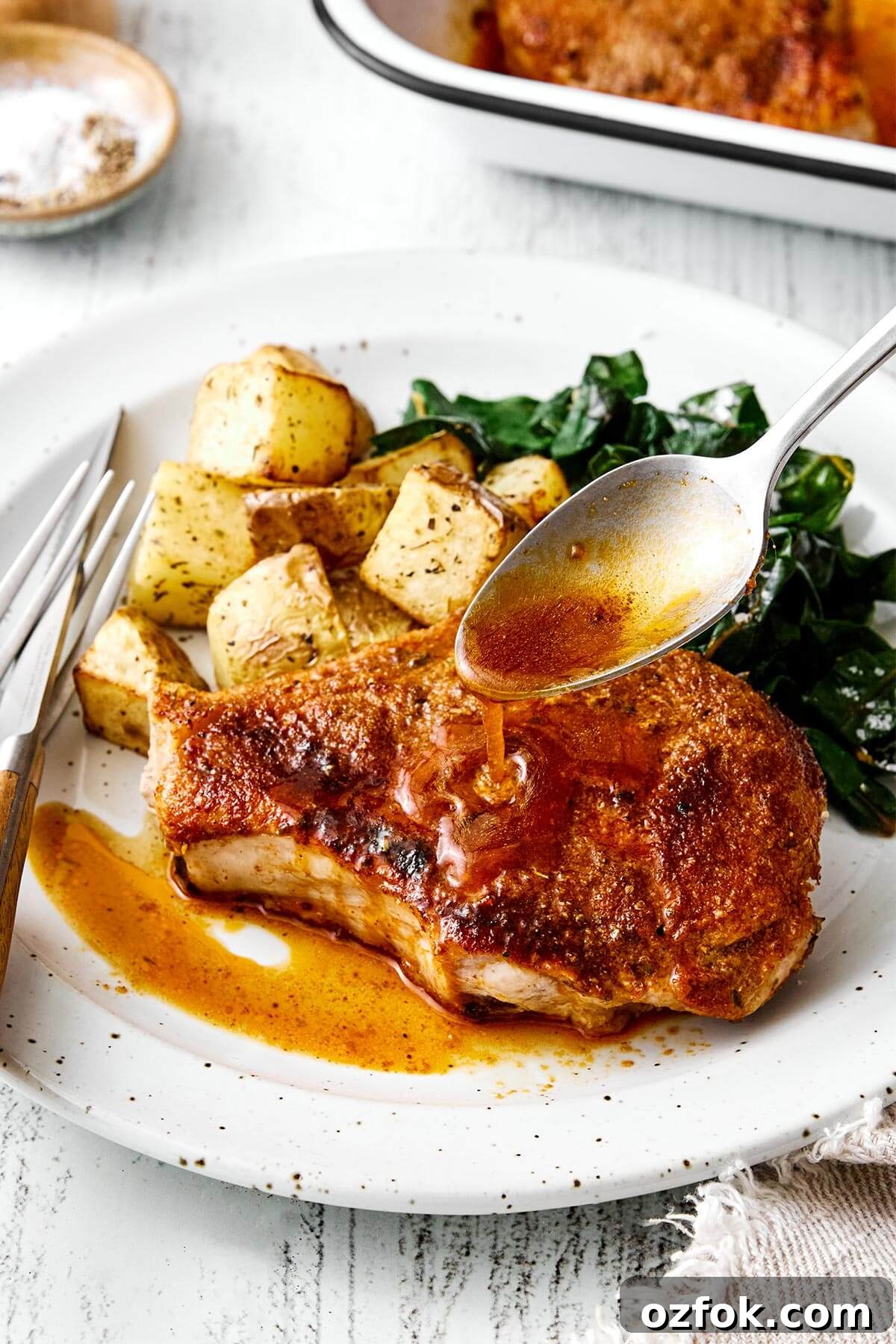 Baked pork chops with roasted potatoes.