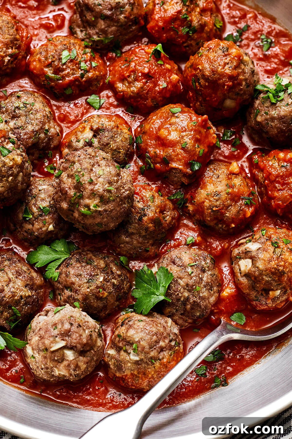 Close up of meatballs in marinara sauce