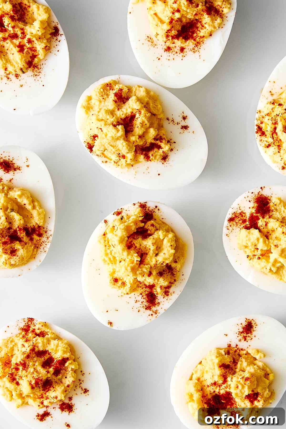 Deviled eggs on a white plate.