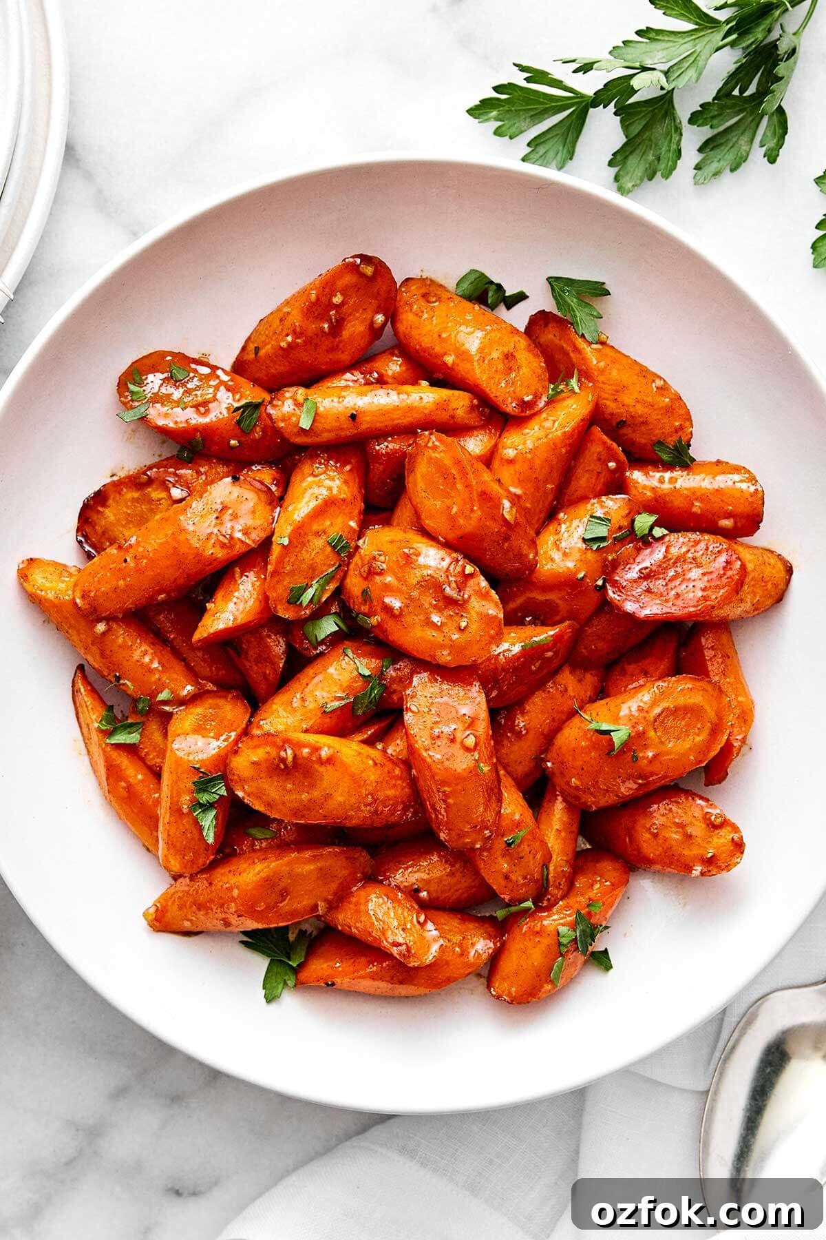 A bowl of honey glazed carrots.