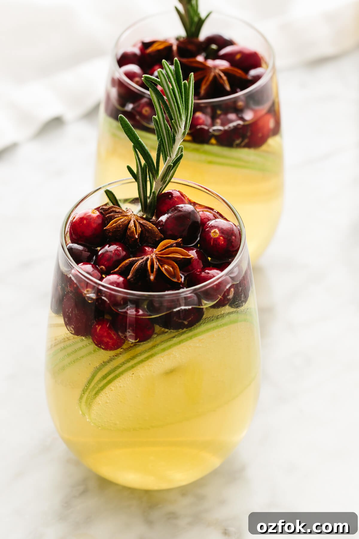 White Christmas sangria in two glasses on a table.