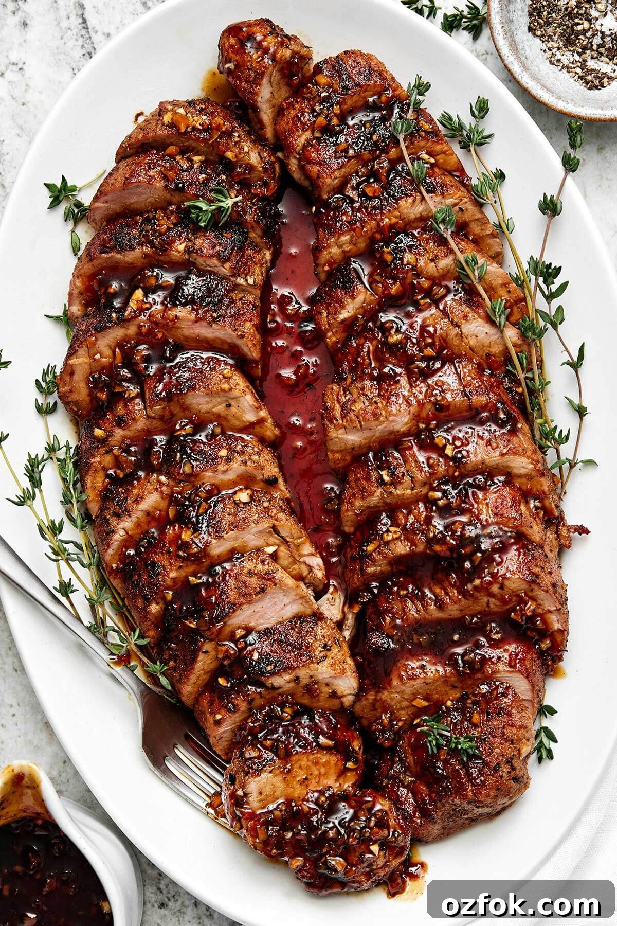 Honey garlic pork tenderloin on a plate.